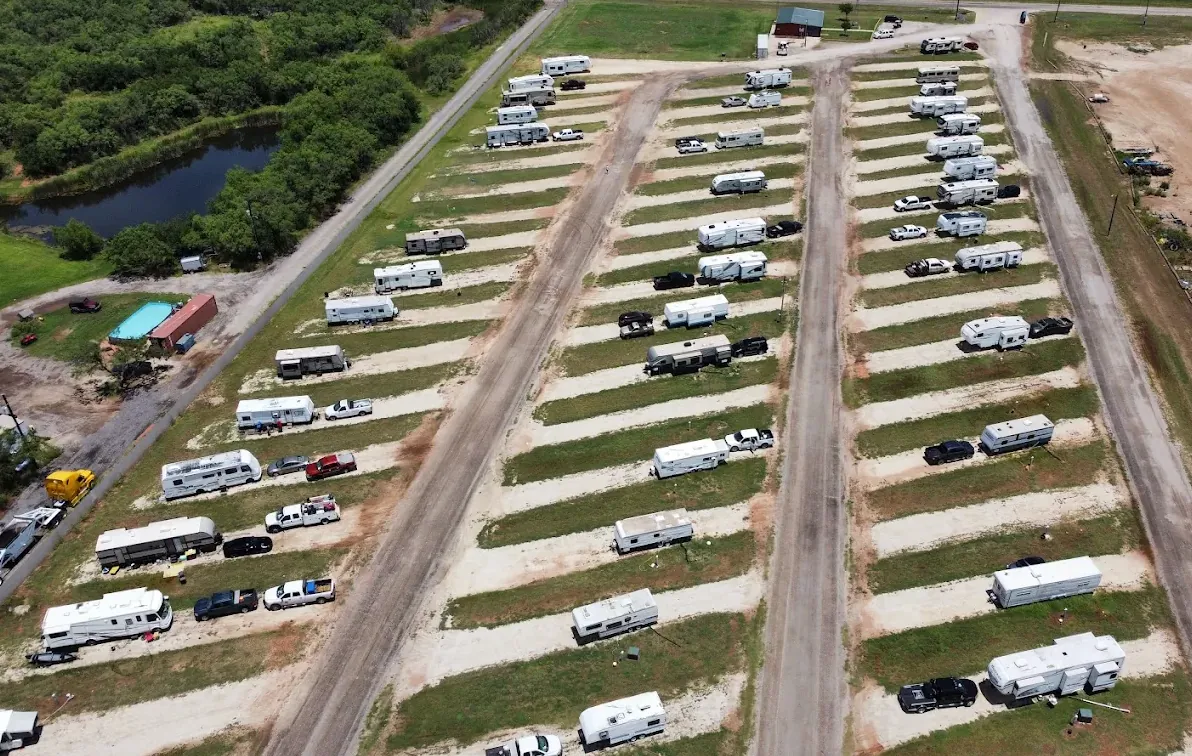 Rows of full-hookup pull-through RV sites at a Buck Creek community