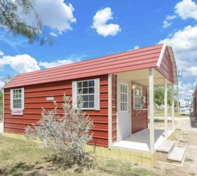 Red laundry building with a covered porch